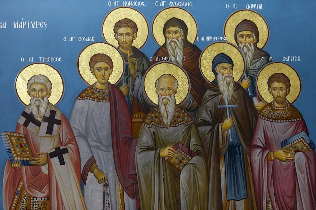 Published photograph of a section of the Tiberiopolis martyrs fresco: Timothy the bishop, Thomas the deacon, Komasios, Eusebius, Daniel, Nikephoros the priest, Theodore the priest, Sergius the priest. The full published photographic frame is retained.