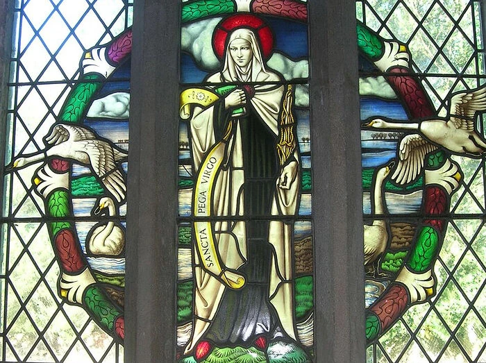 Stained-glass depiction of Pega of Peakirk at Peakirk.