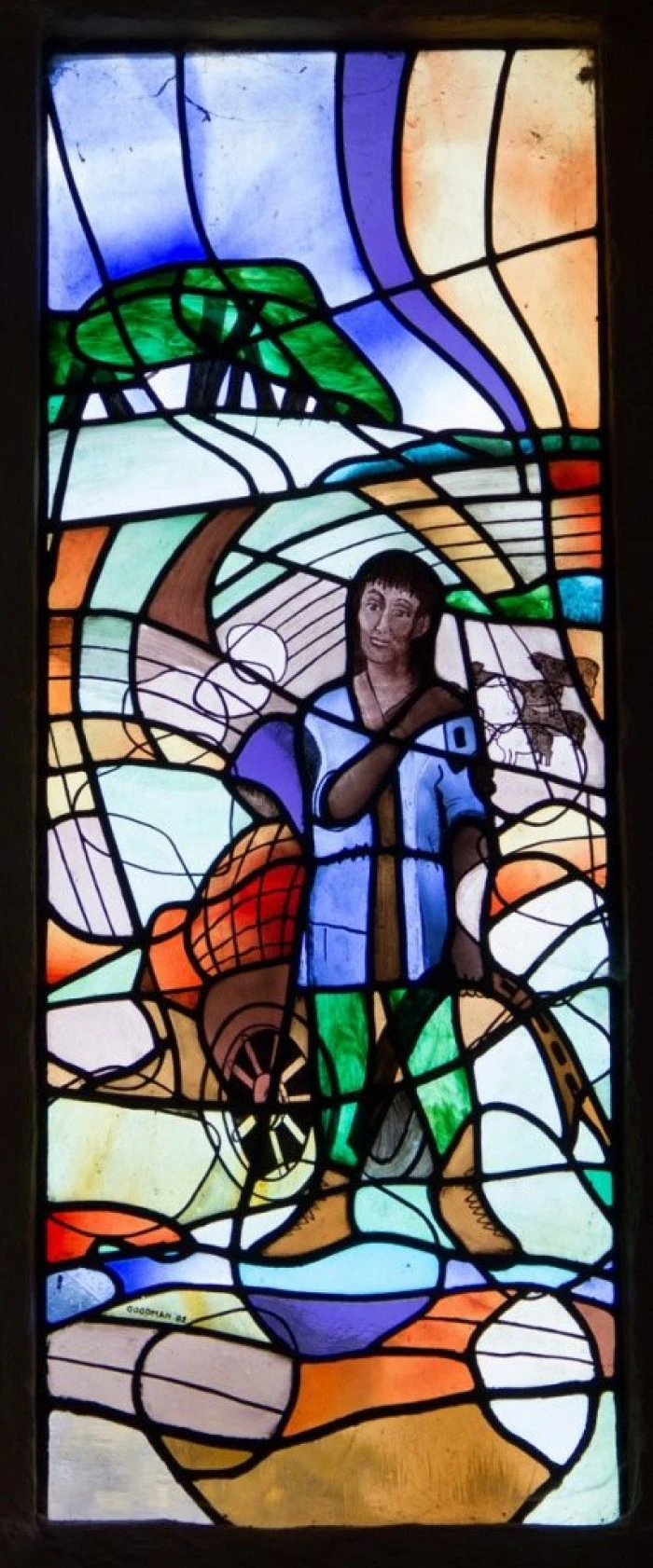 Stained-glass depiction of Cuthman with his mother in a barrow, in the Cuthman Chapel at Steyning.